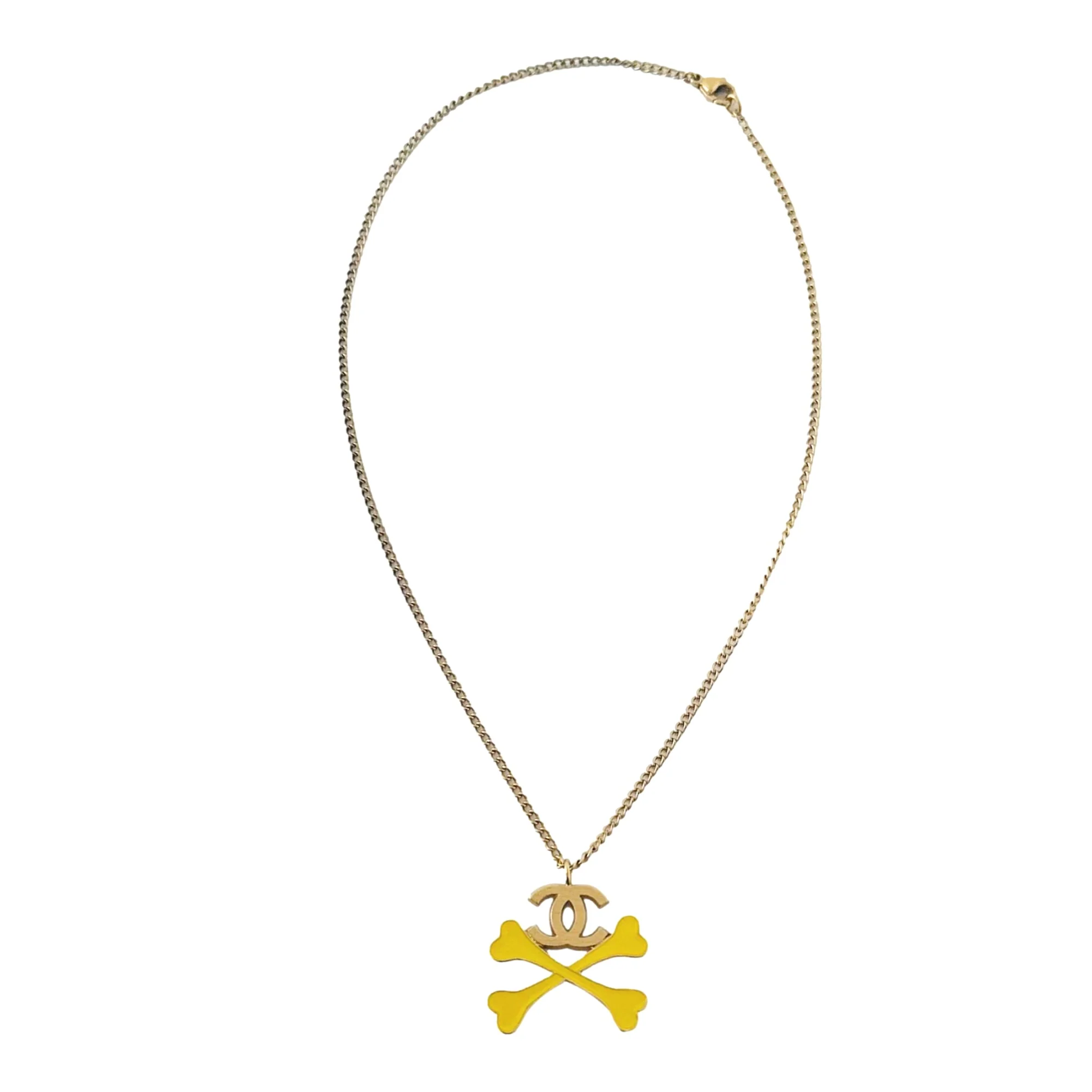 Chanel Gold + Yellow Cross Bones Logo Necklace